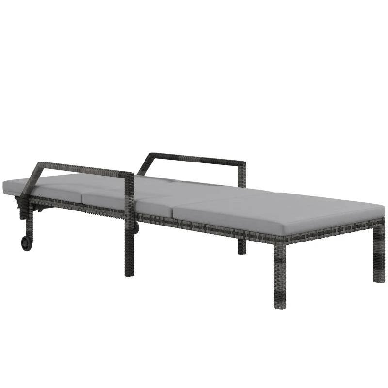 Rattan chaise lounge with gray seat cushion and raised end armrests