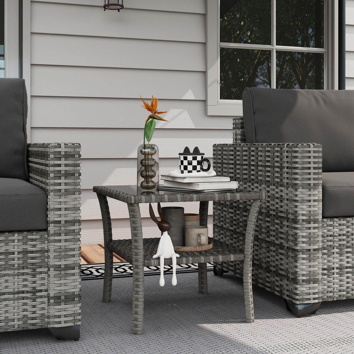 Grey PE rattan two-tier outdoor coffee table with clear glass top, square frame
