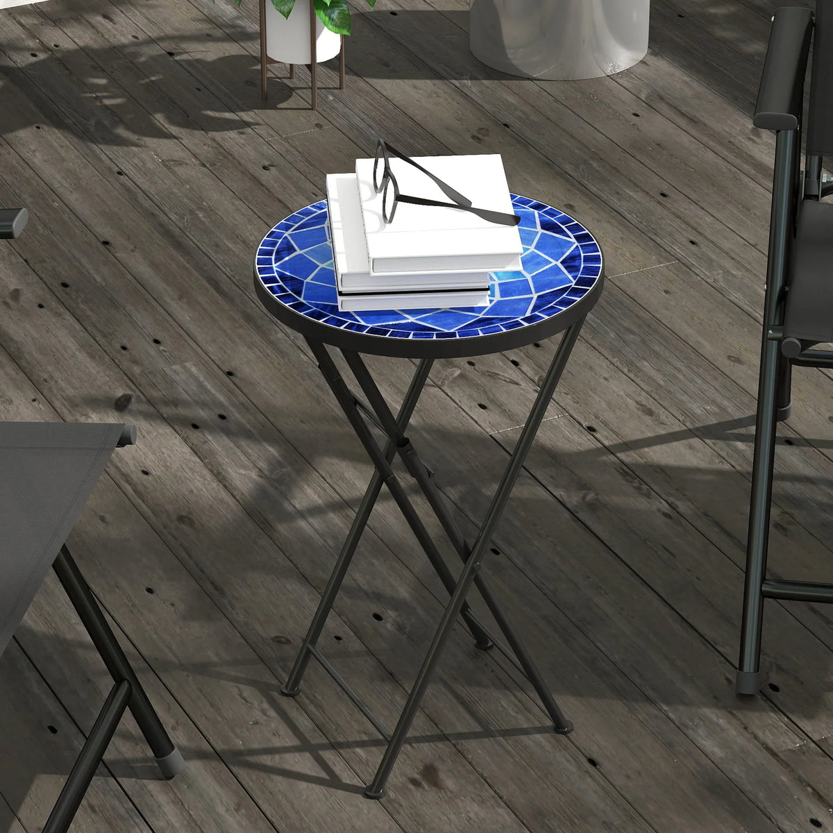 Navy mosaic round folding table with white items on black metal legs