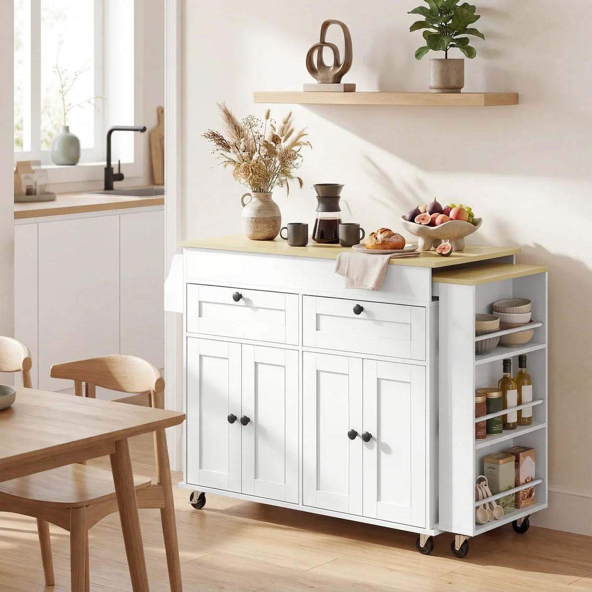 White rolling kitchen island with light wood top, open shelving pantry, and caster wheels.