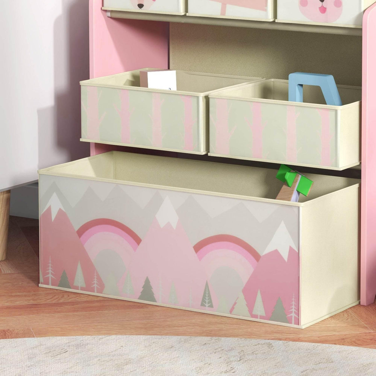 Pink kids storage unit with stacked open bins and patterned fabric drawers