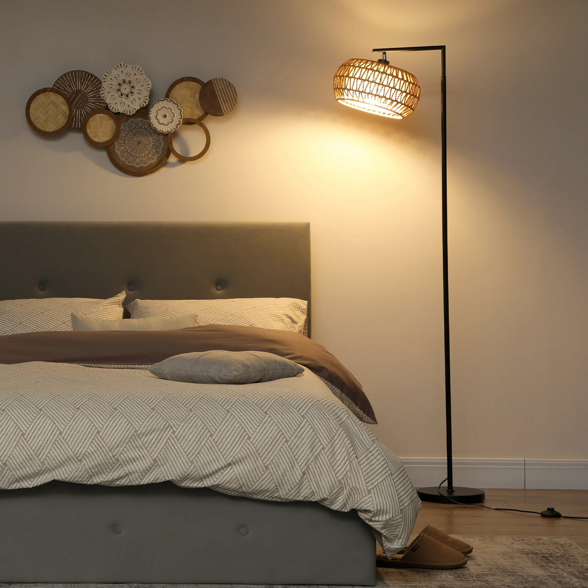 HOMCOM boho floor lamp with woven drum shade casting warm light near bed