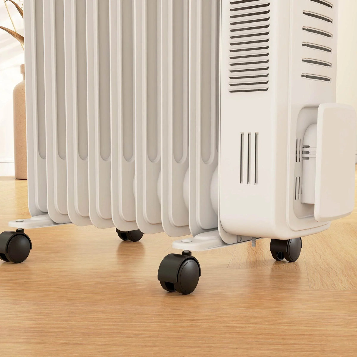 White 9-fin oil radiator heater close-up of fins and bottom caster wheels