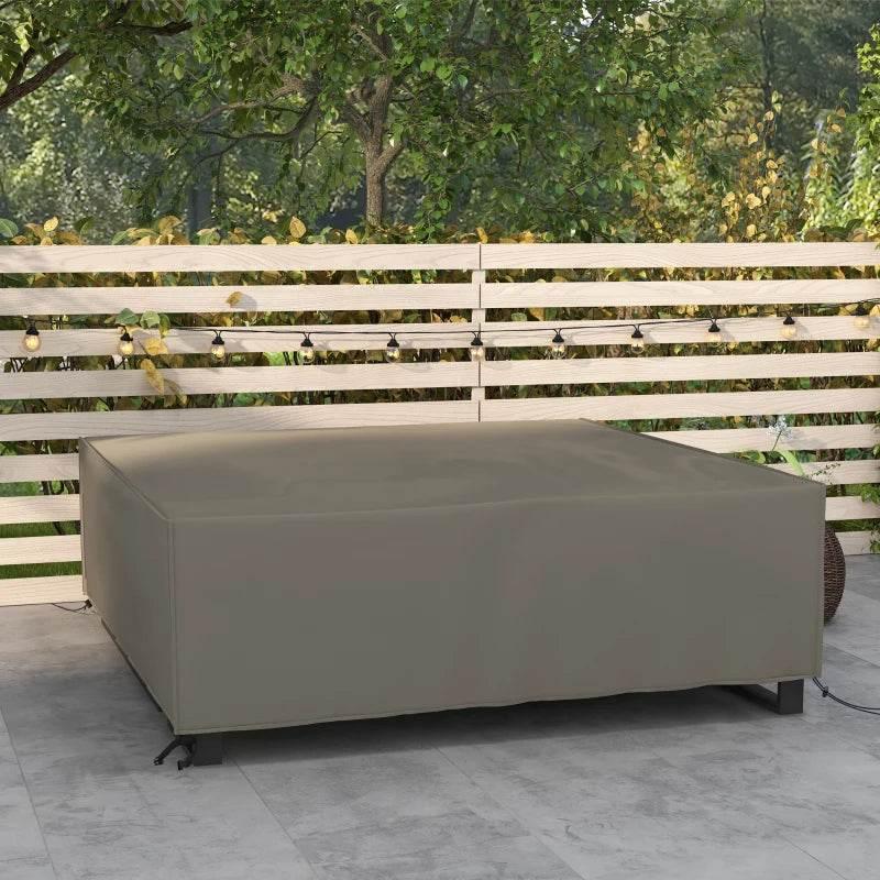 Grey square patio furniture cover draped over outdoor seating base