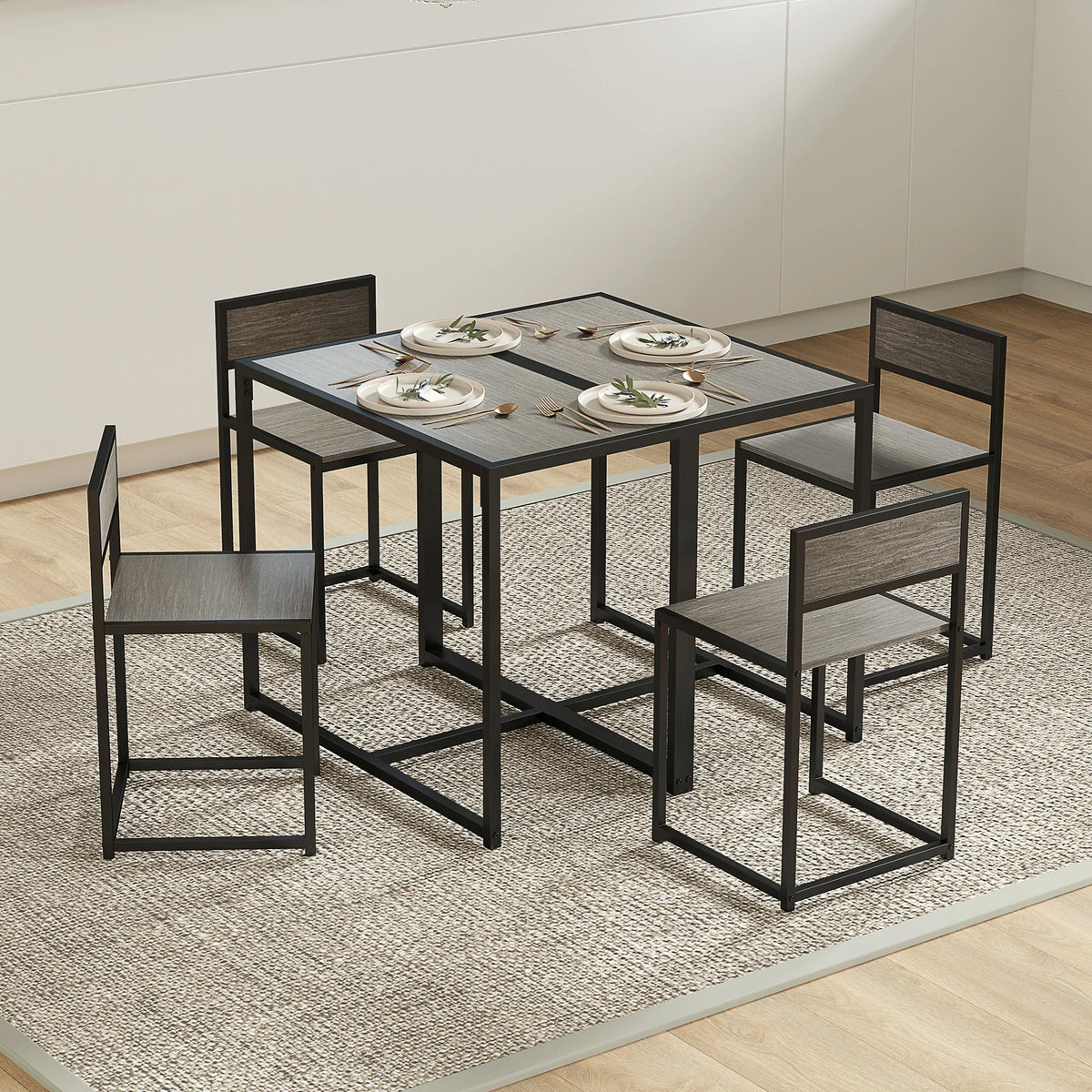 Rectangular dining table with two open-back chairs arranged for seating, grey wood-effect