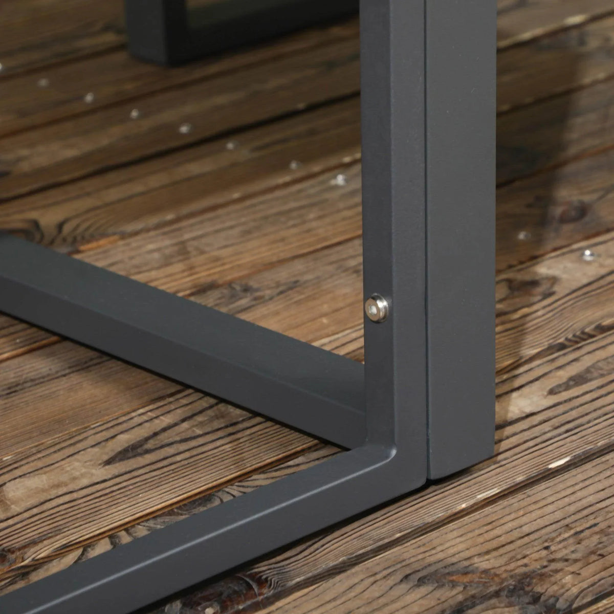 Dark aluminum sofa table leg and crossbar joint with mounting screw