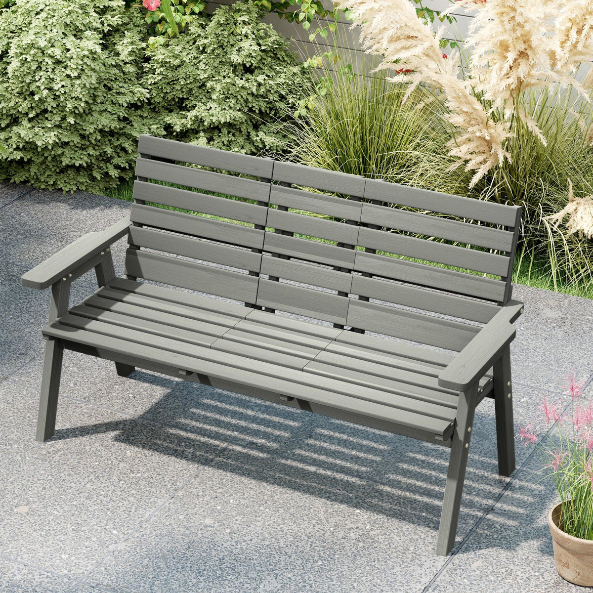 Grey slat garden bench with side armrests and built-in center table