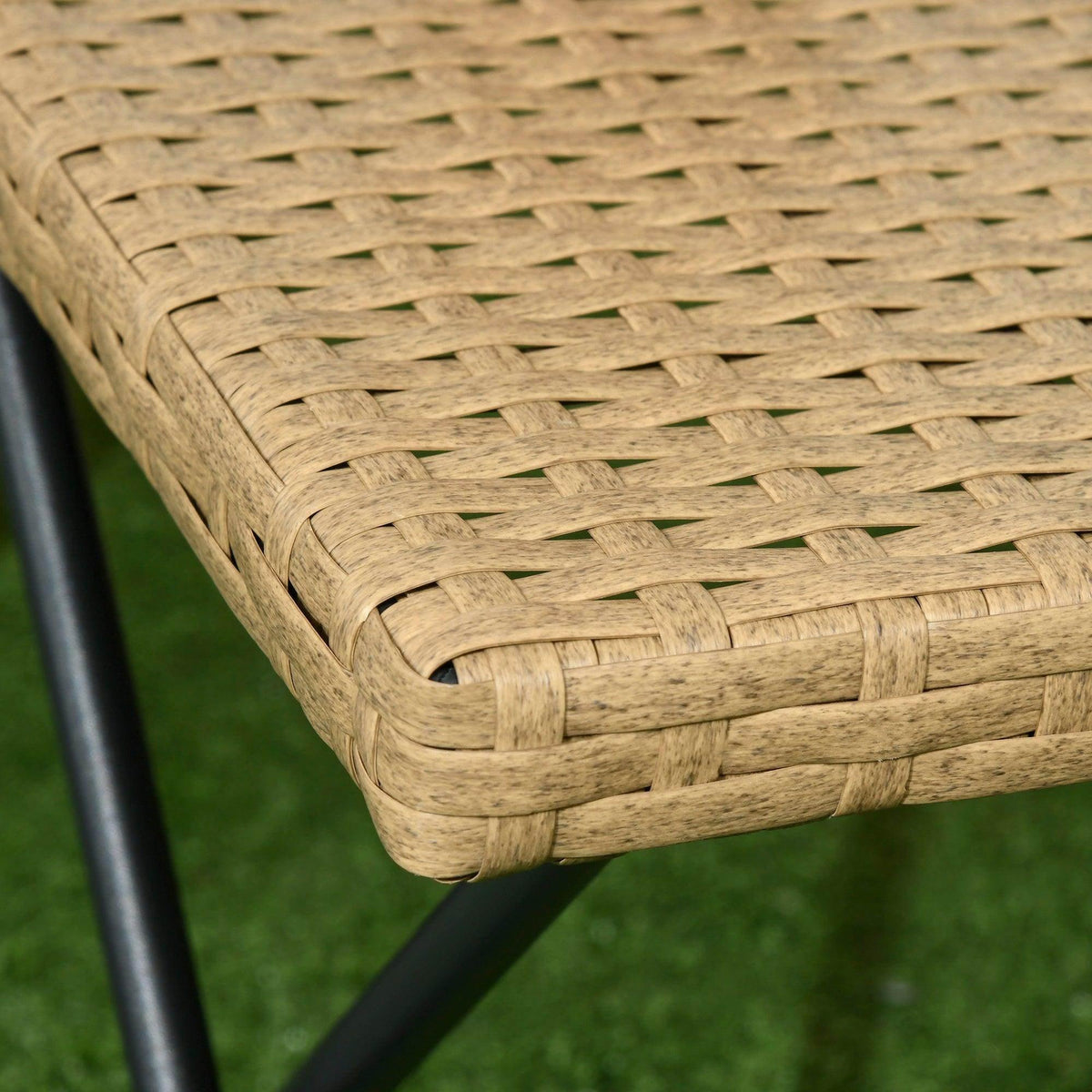 Close-up of natural rattan woven corner on square folding coffee table
