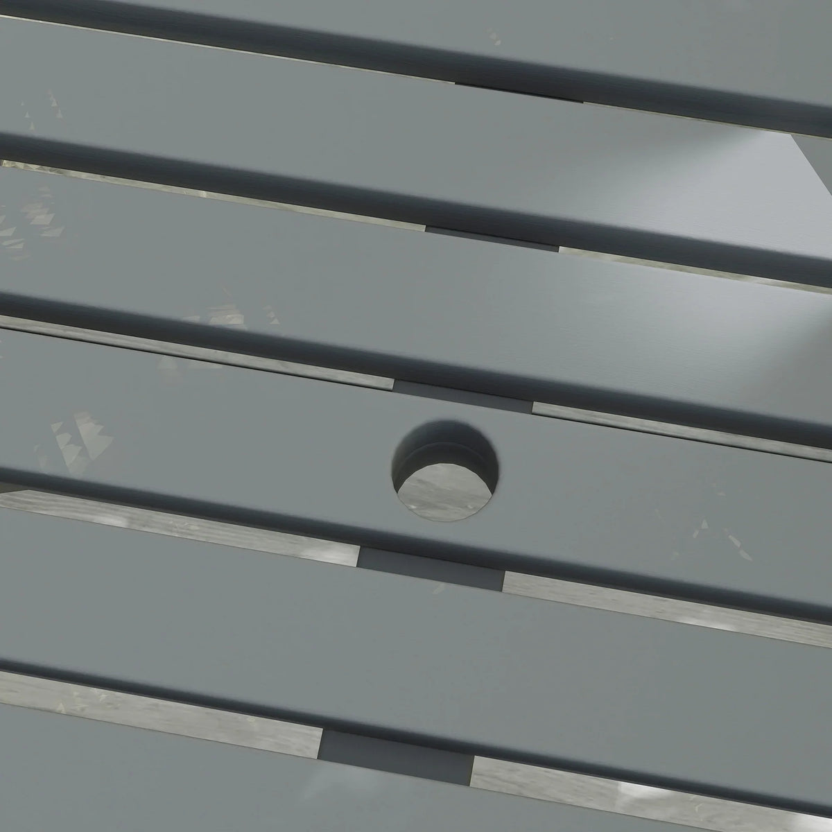 Grey slatted tabletop close-up with round parasol hole