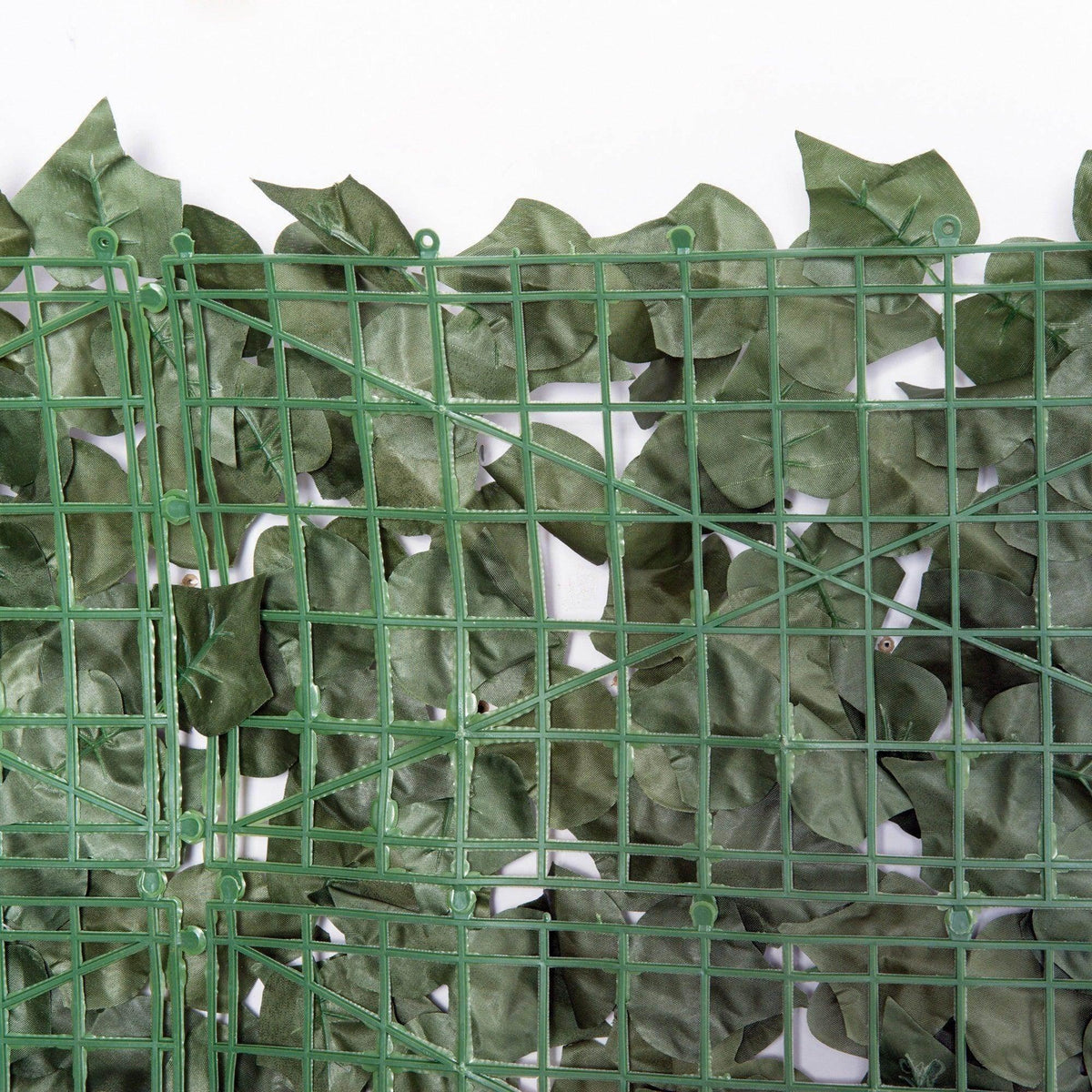 Dark green artificial hedge privacy screen with mesh grid frame and layered leaf details