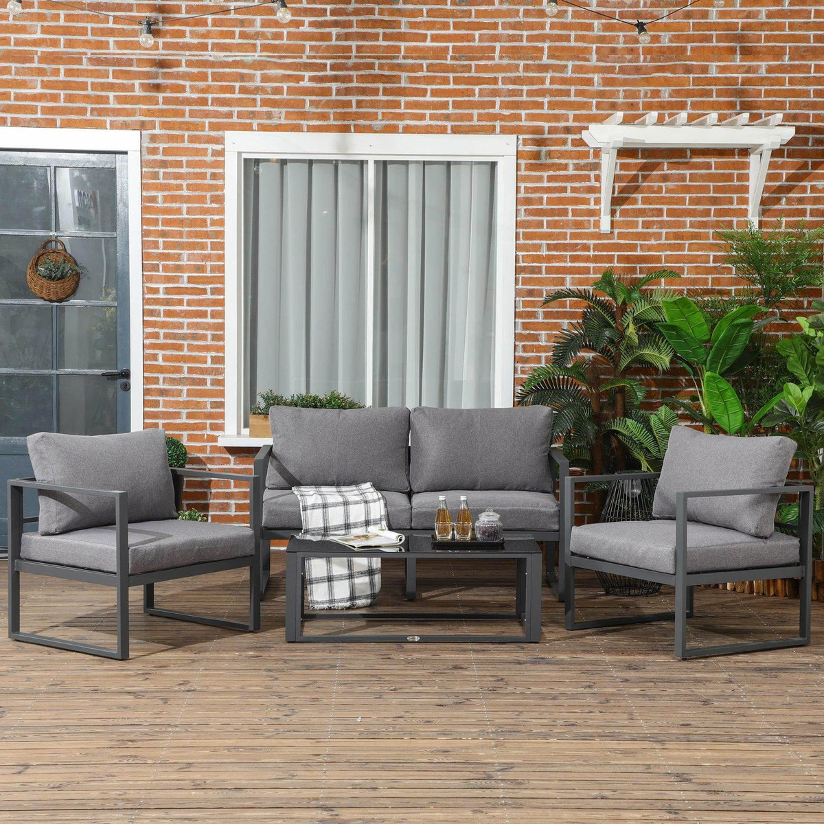 4-piece outdoor sectional sofa set with grey cushions and dark aluminum frame