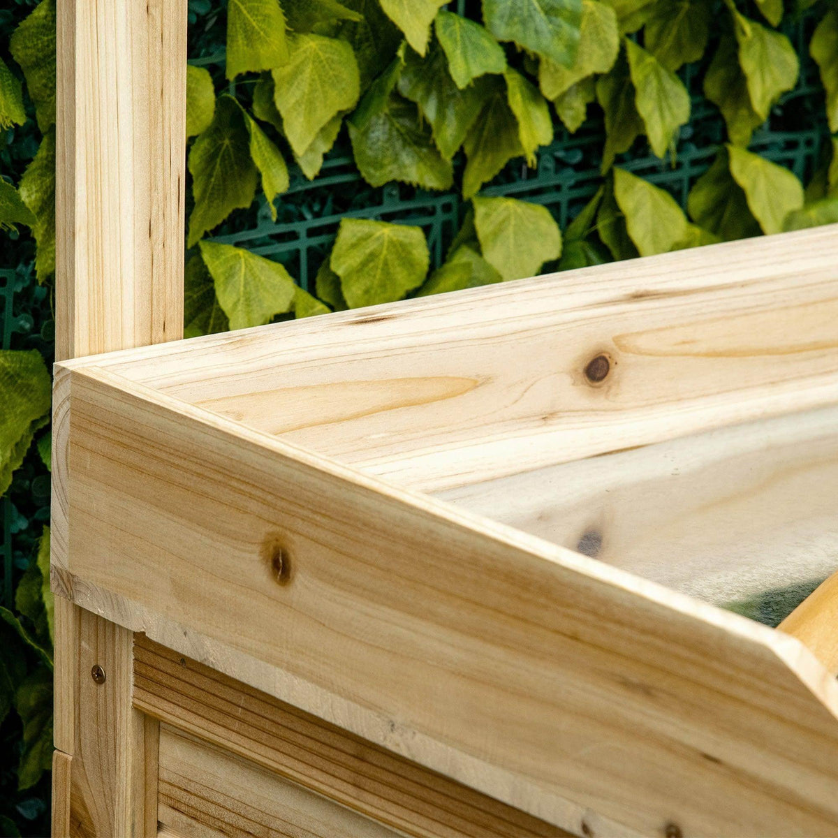 Light wood potting bench tabletop edge close-up with visible grain and smooth finish