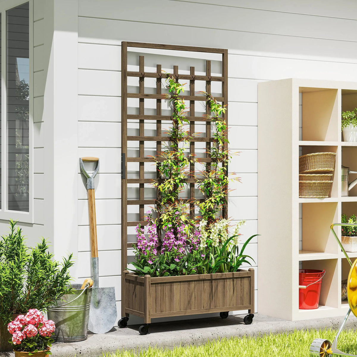 Brown wooden raised planter box with lattice trellis and caster wheels, holding flowers and herbs