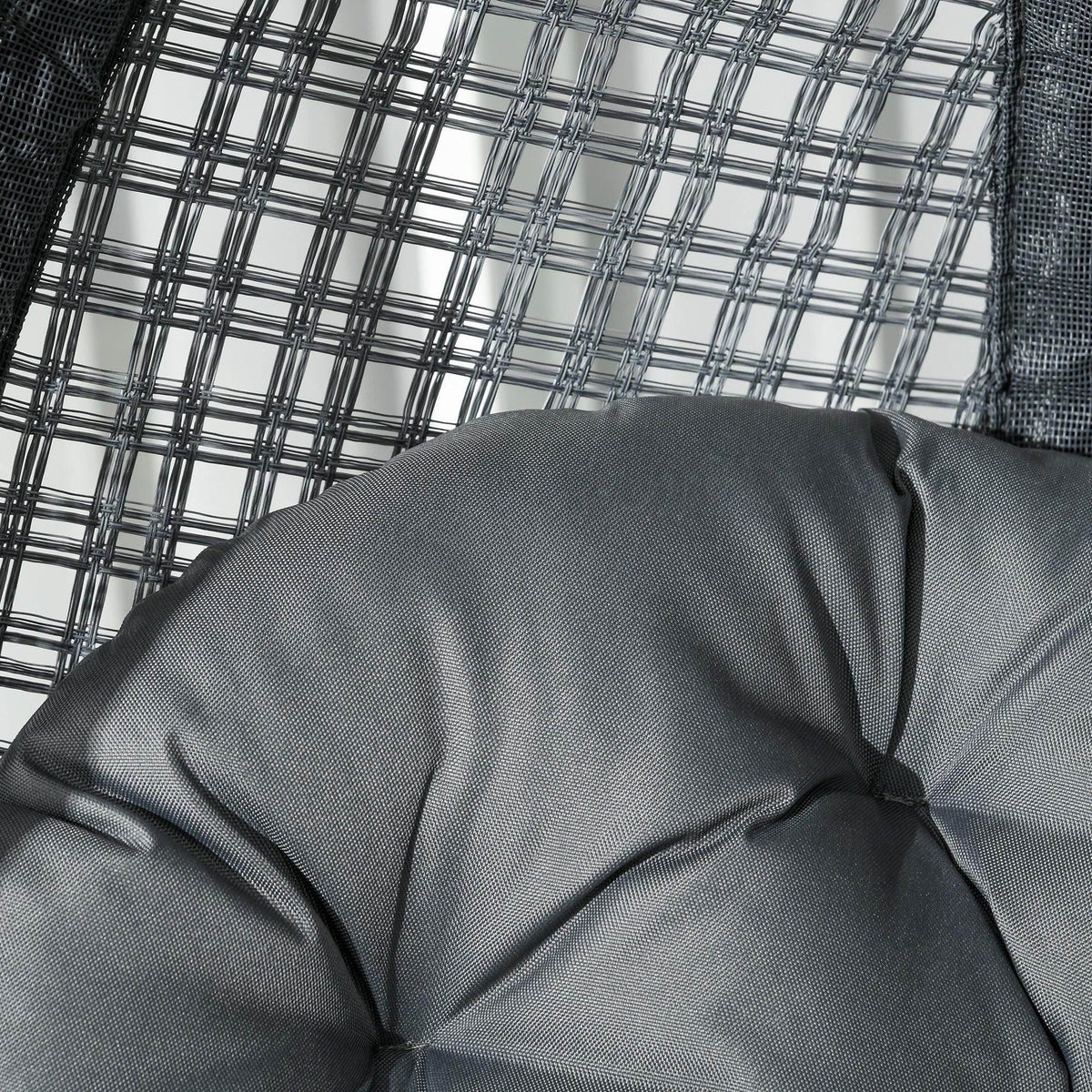 Close-up of dark grey quilted padded cushion inside a hanging mesh swing chair