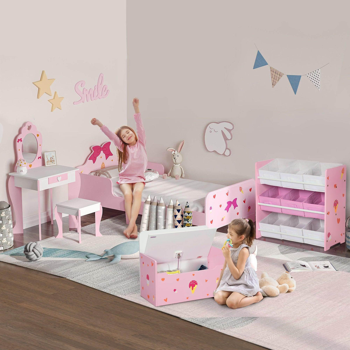 Kids pink play furniture set with bed, vanity table, bench, and storage box