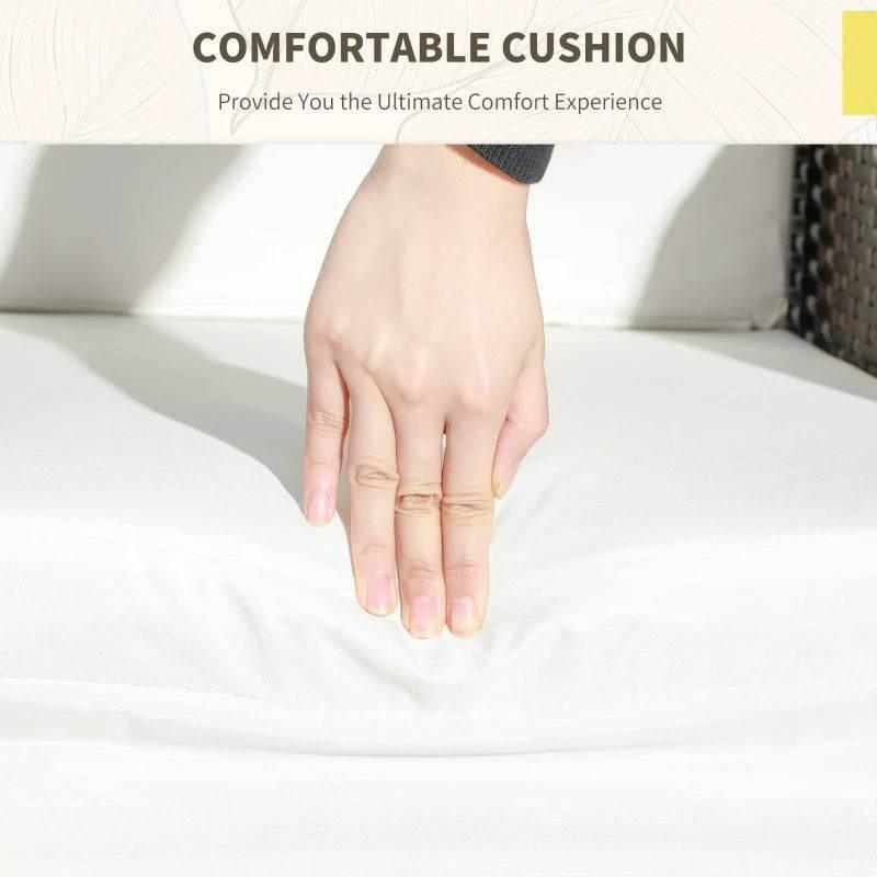 White chair cushion with textured fabric on mixed-brown rattan lounge chair