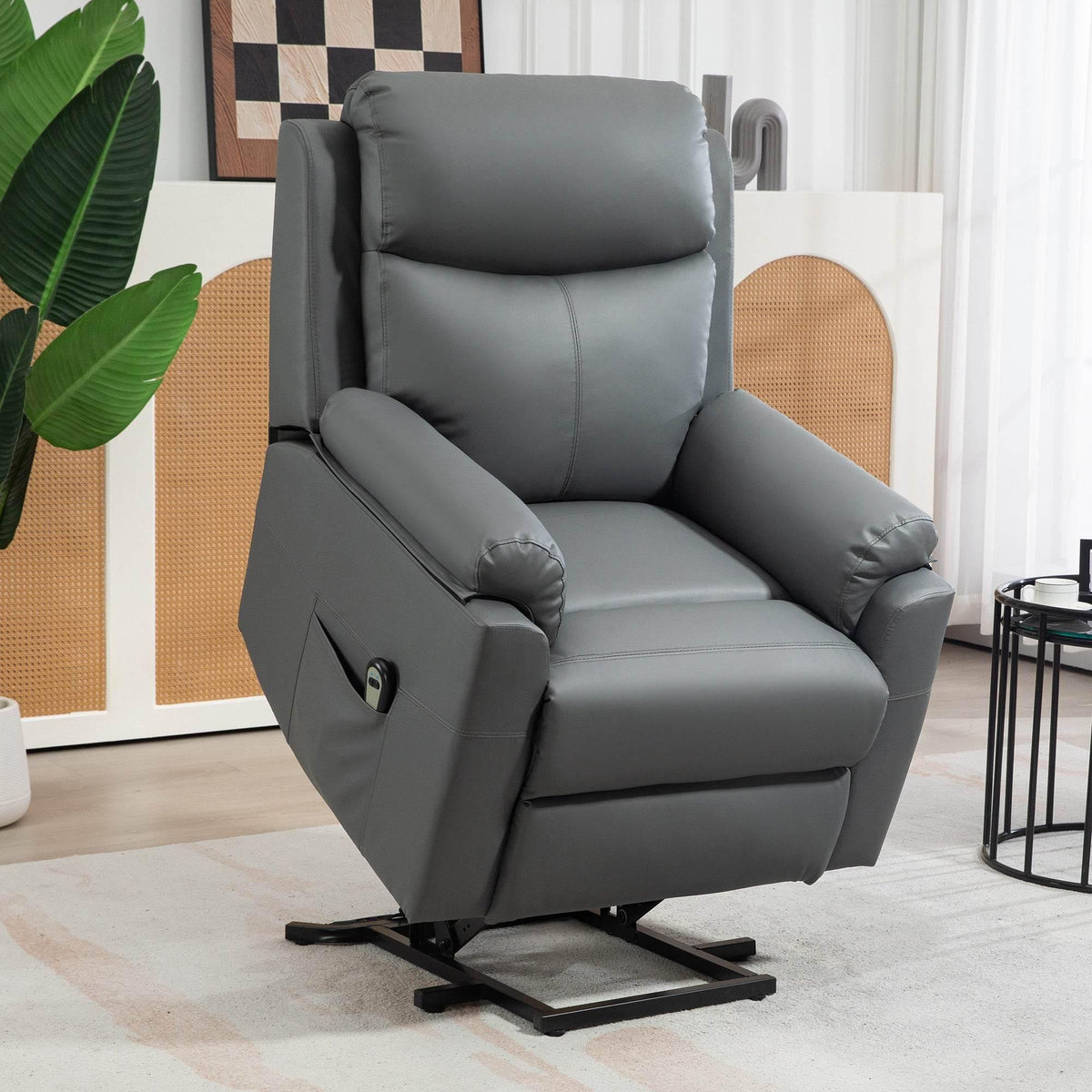 Charcoal grey electric lift recliner chair with padded armrests and side control panel