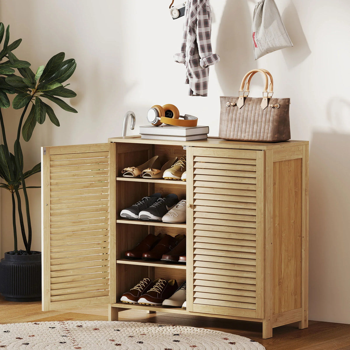 Natural bamboo shoe cabinet with louvered doors and open shelving for sneakers