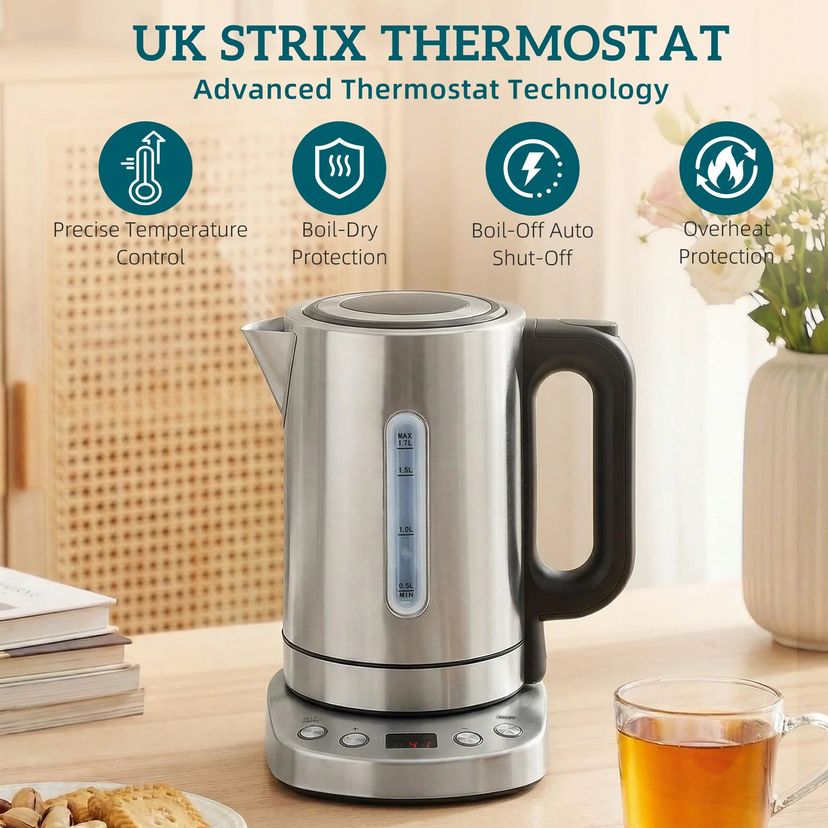 Silver electric kettle with black handle and base, UK thermostat label on front