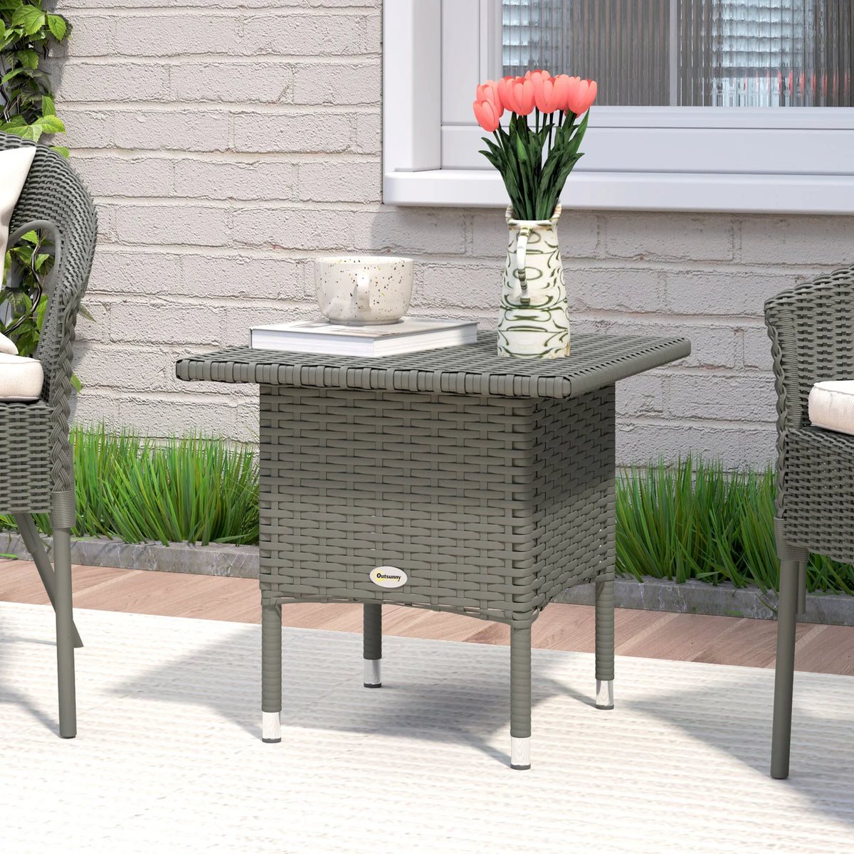 Grey woven outdoor side table with square top and four sturdy legs