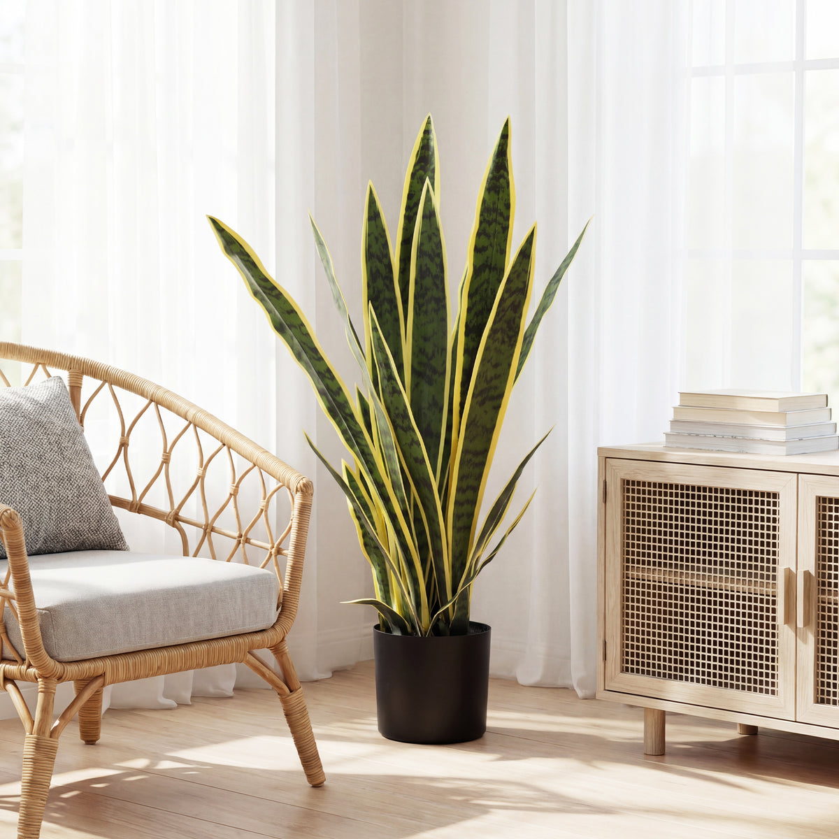 Artificial snake plant with variegated leaves in black pot