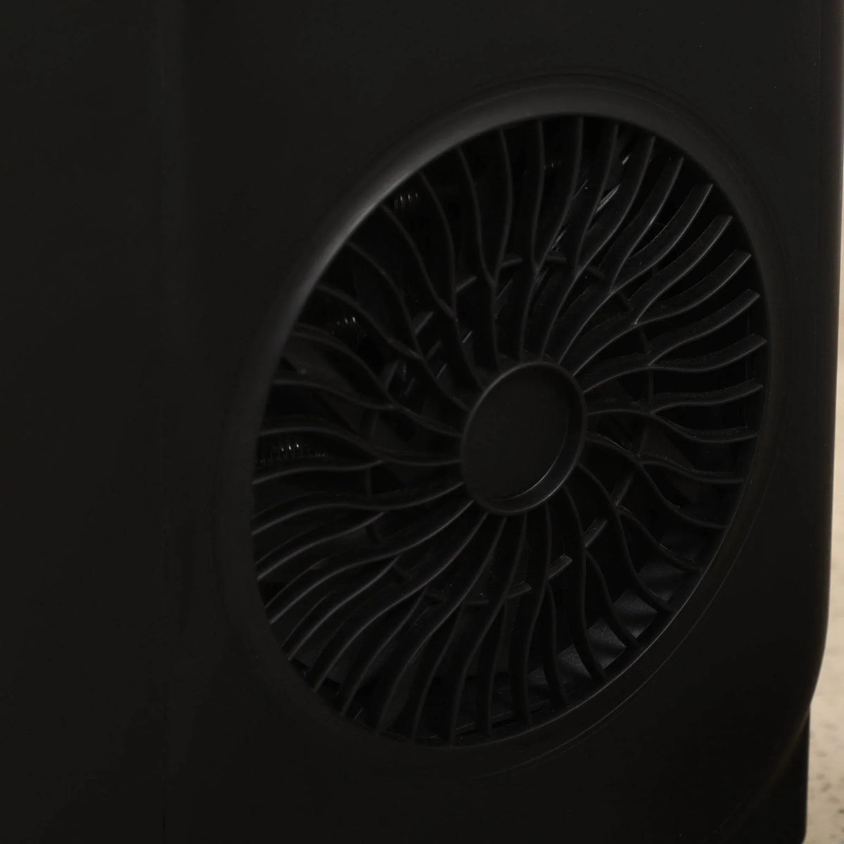 Close-up of the black ice maker’s side cooling fan vent