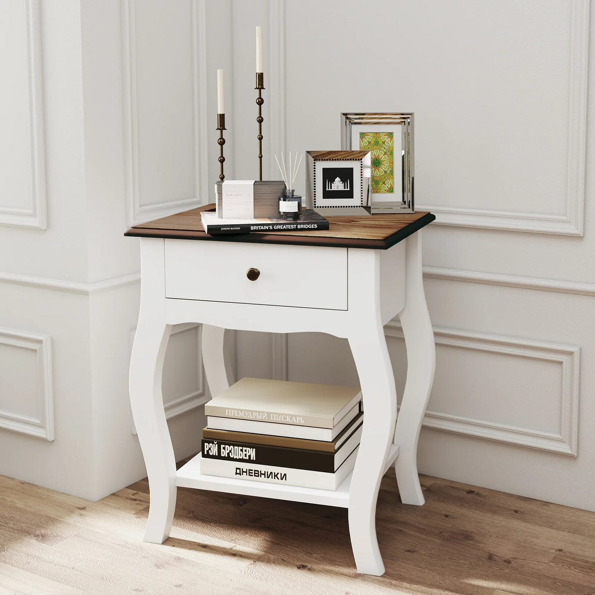 White French-style bedside table with dark wood top, drawer front, and open lower shelf.