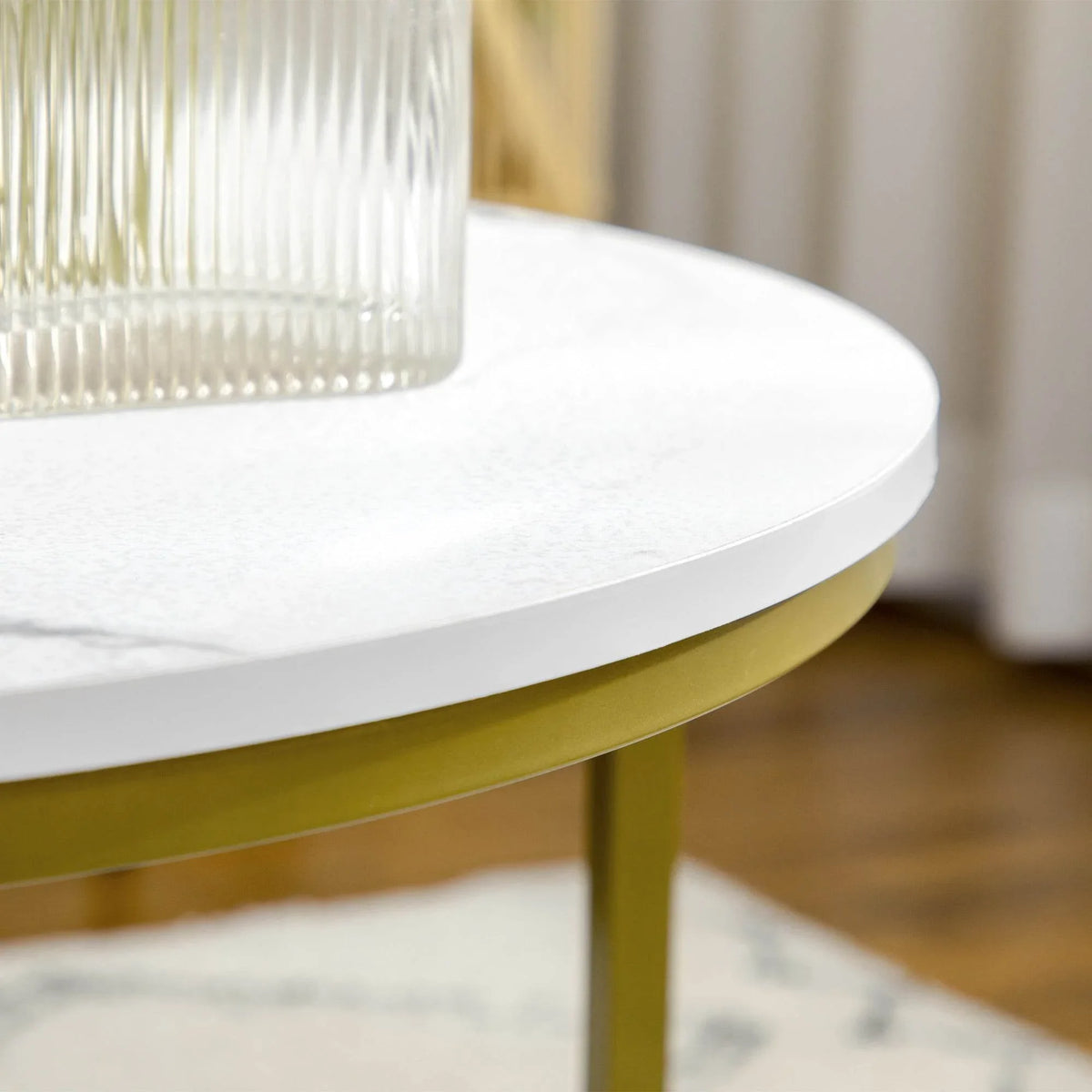 Round white faux marble tabletop with gold metal frame edge
