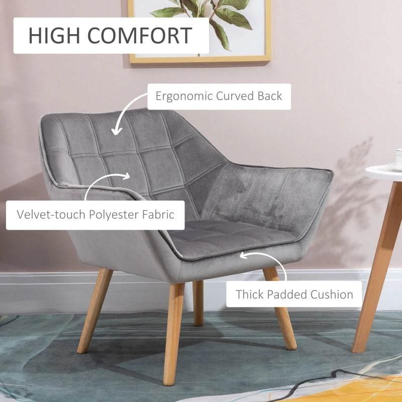 Grey upholstered armchair with curved back, thick padded seat, rubber wood legs