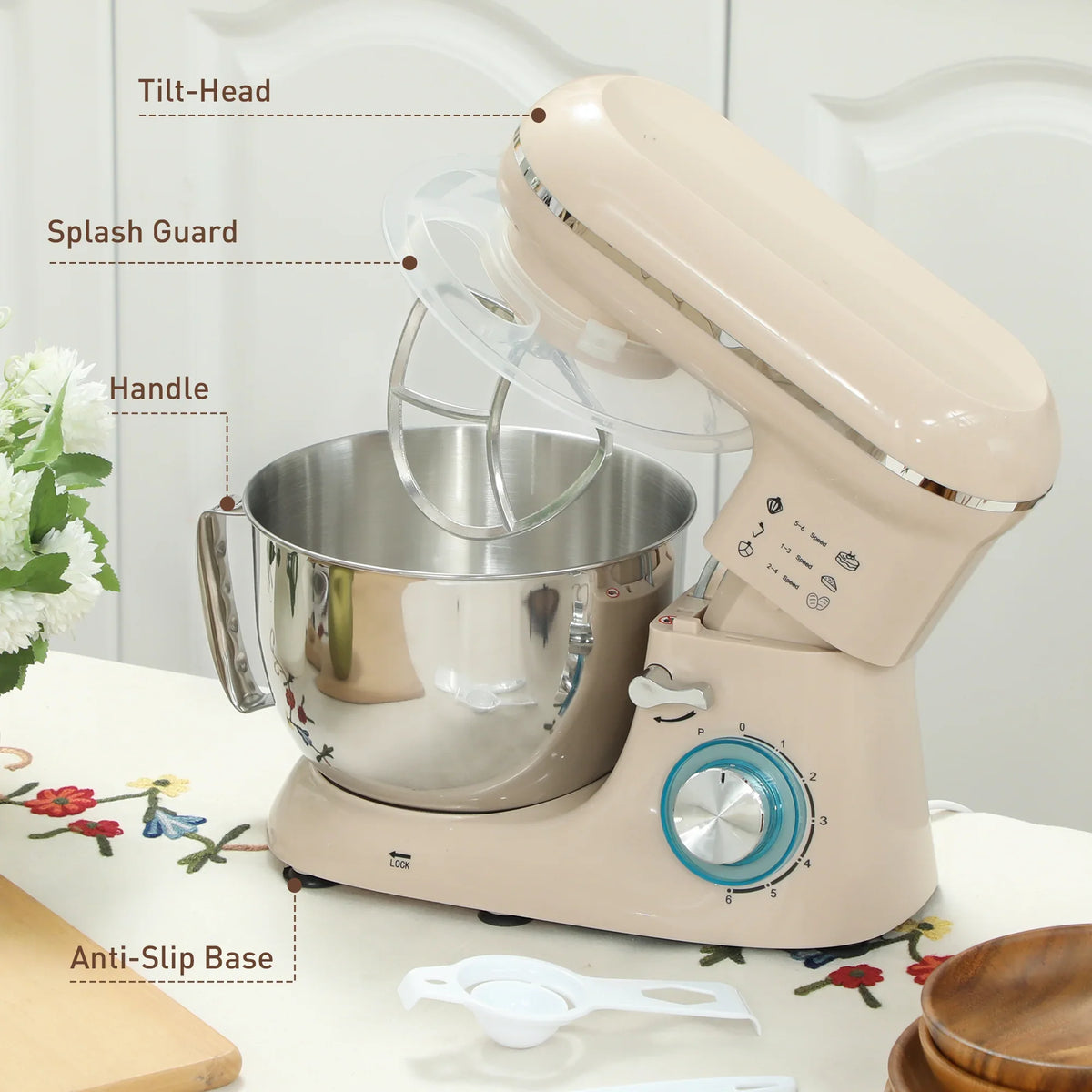 Beige tilt-head stand mixer with splash guard, stainless bowl, and anti-slip base
