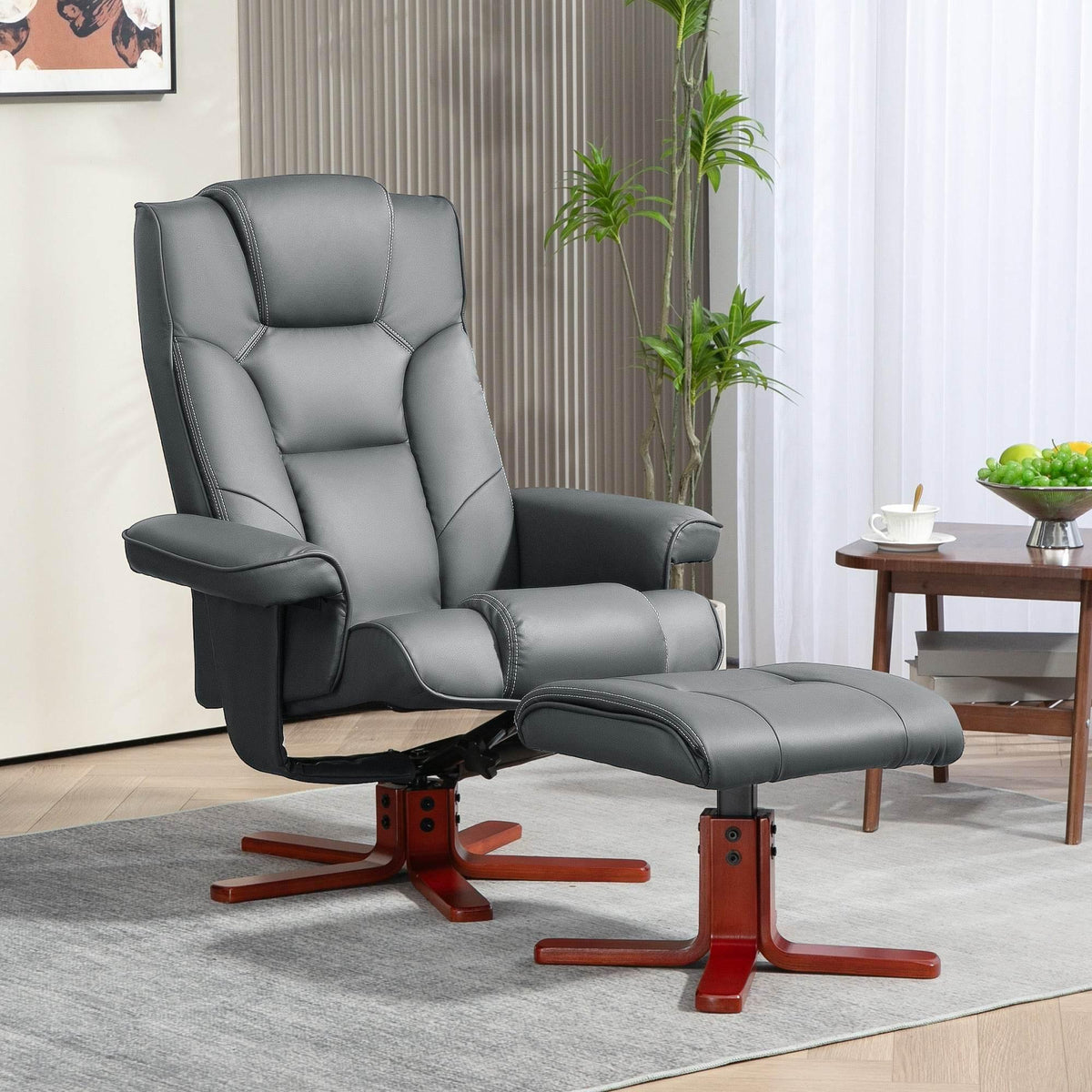 Gray faux leather reclining chair with matching ottoman and red-brown wood base