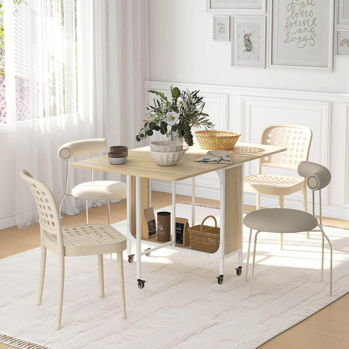 Folding dining table with storage compartment and rolling casters, light wood finish.