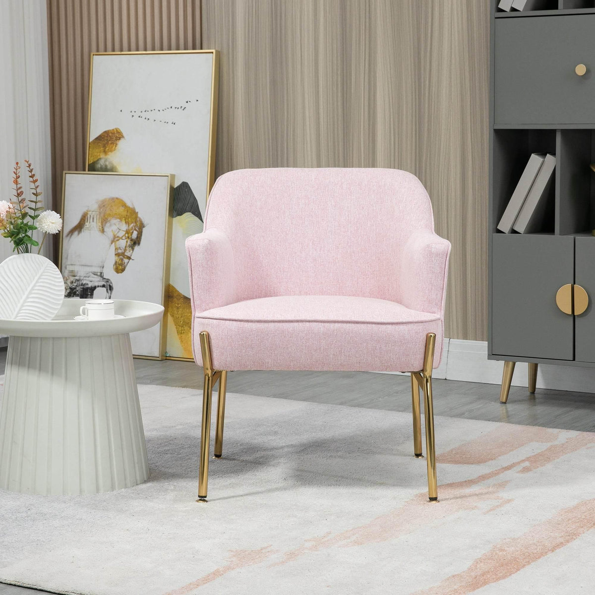 Pink velvet-look accent chair with rounded back and gold legs, front view