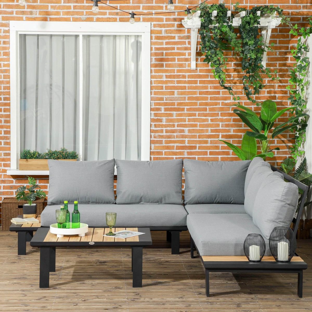 Dark grey outdoor sectional sofa set with cushions and two wooden coffee tables
