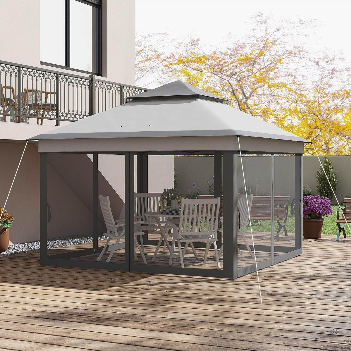 Grey pop-up gazebo with dark mesh side curtains and open lounge area on a wooden deck