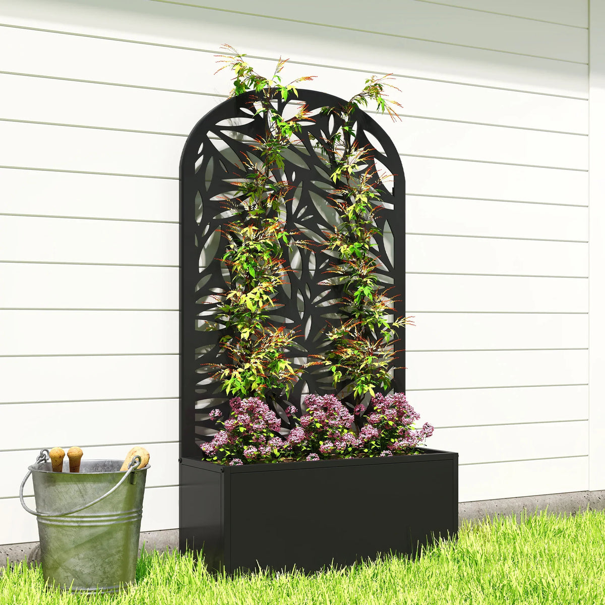 Black wall-mounted curved trellis planter with leaf-pattern privacy screen and blooms