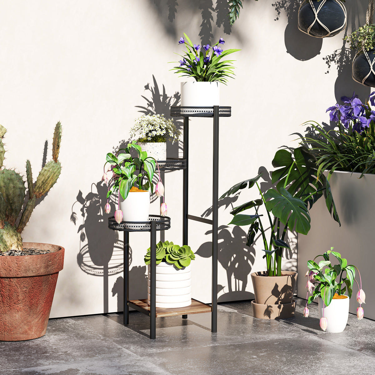 Black four-tier plant stand with three raised planter tray shelves and steel frame