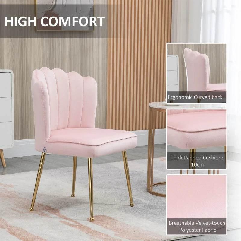 Pink upholstered dining chair with curved shell back, thick seat, and gold legs