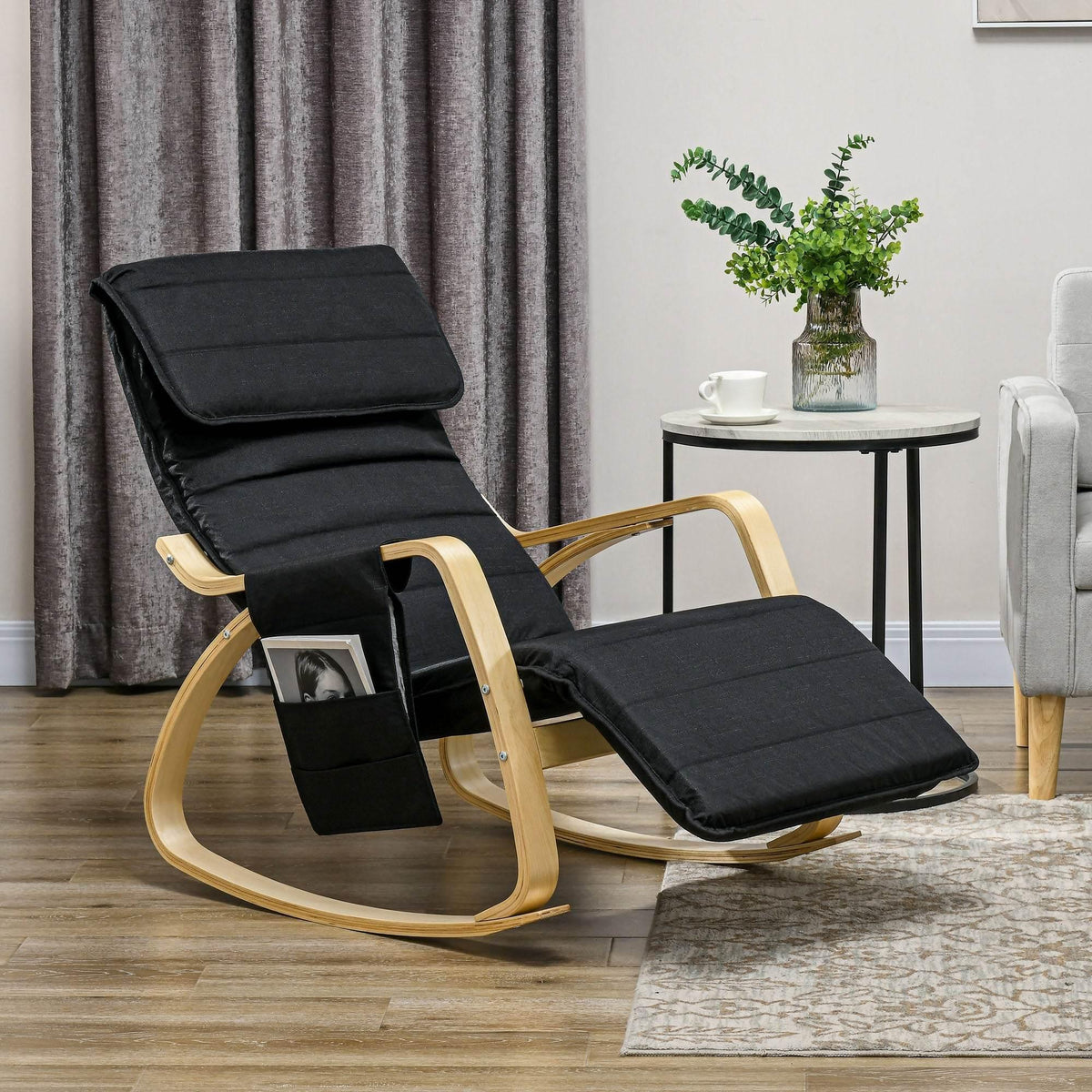Black rocking recliner lounge chair with footrest and headrest pillow