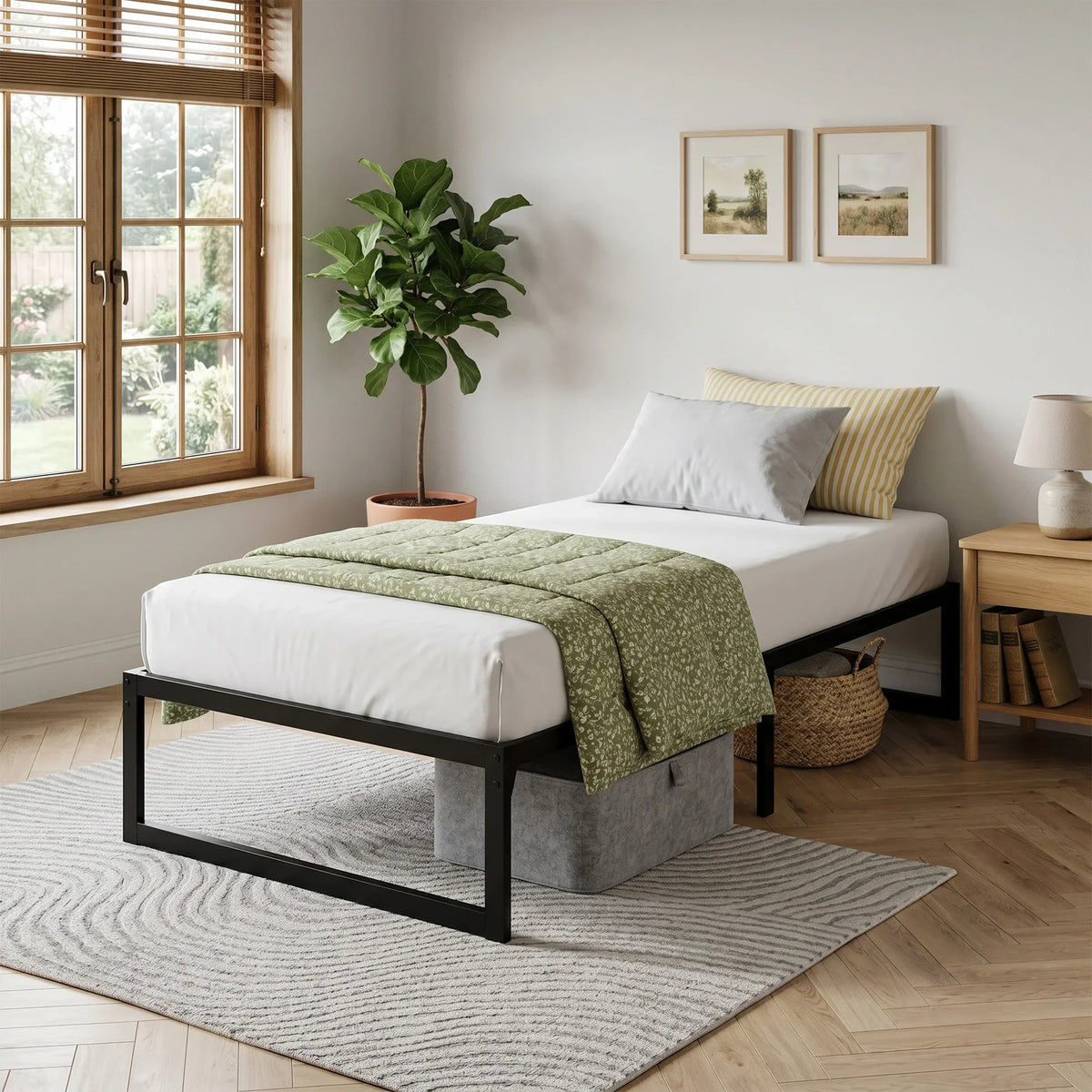 Black single bed frame with underbed storage drawers and metal slat base on legs