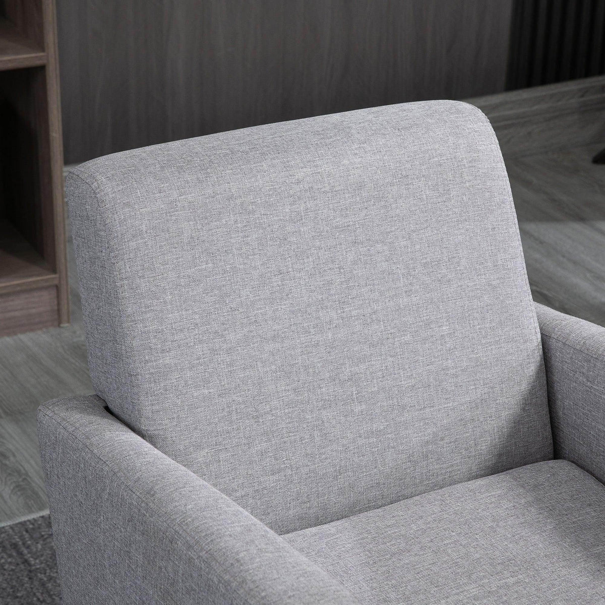 Light grey fabric accent chair with tall backrest and smooth seat cushion