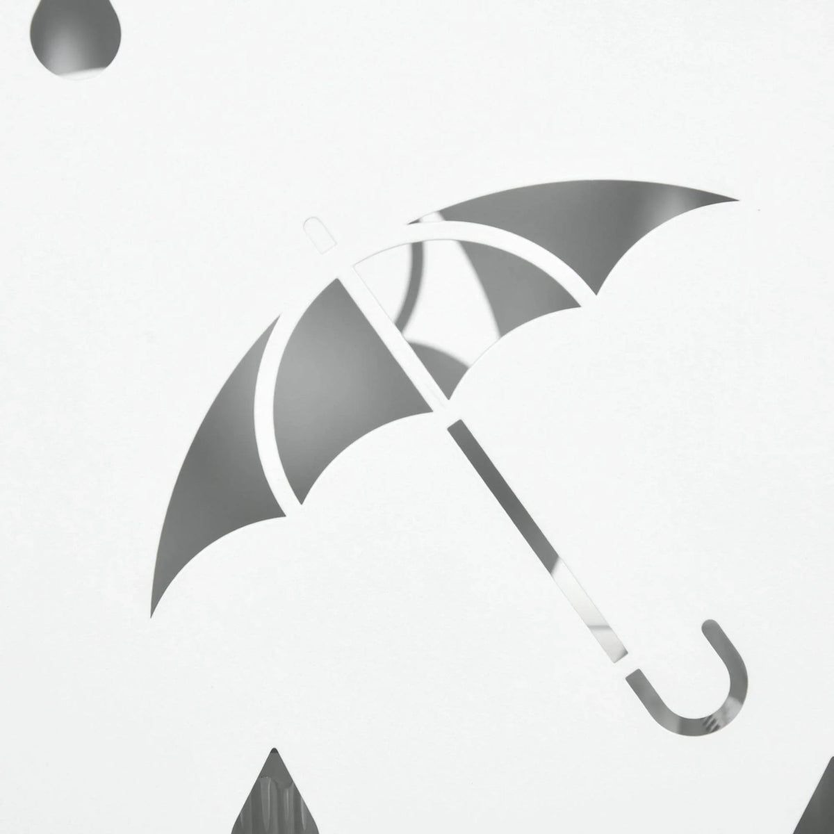 White umbrella holder stand close-up with umbrella icon cutout