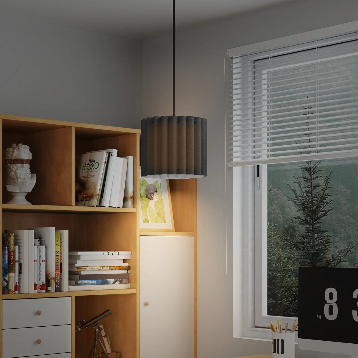 Black ribbed fabric pendant light hanging over bookshelf in a modern room