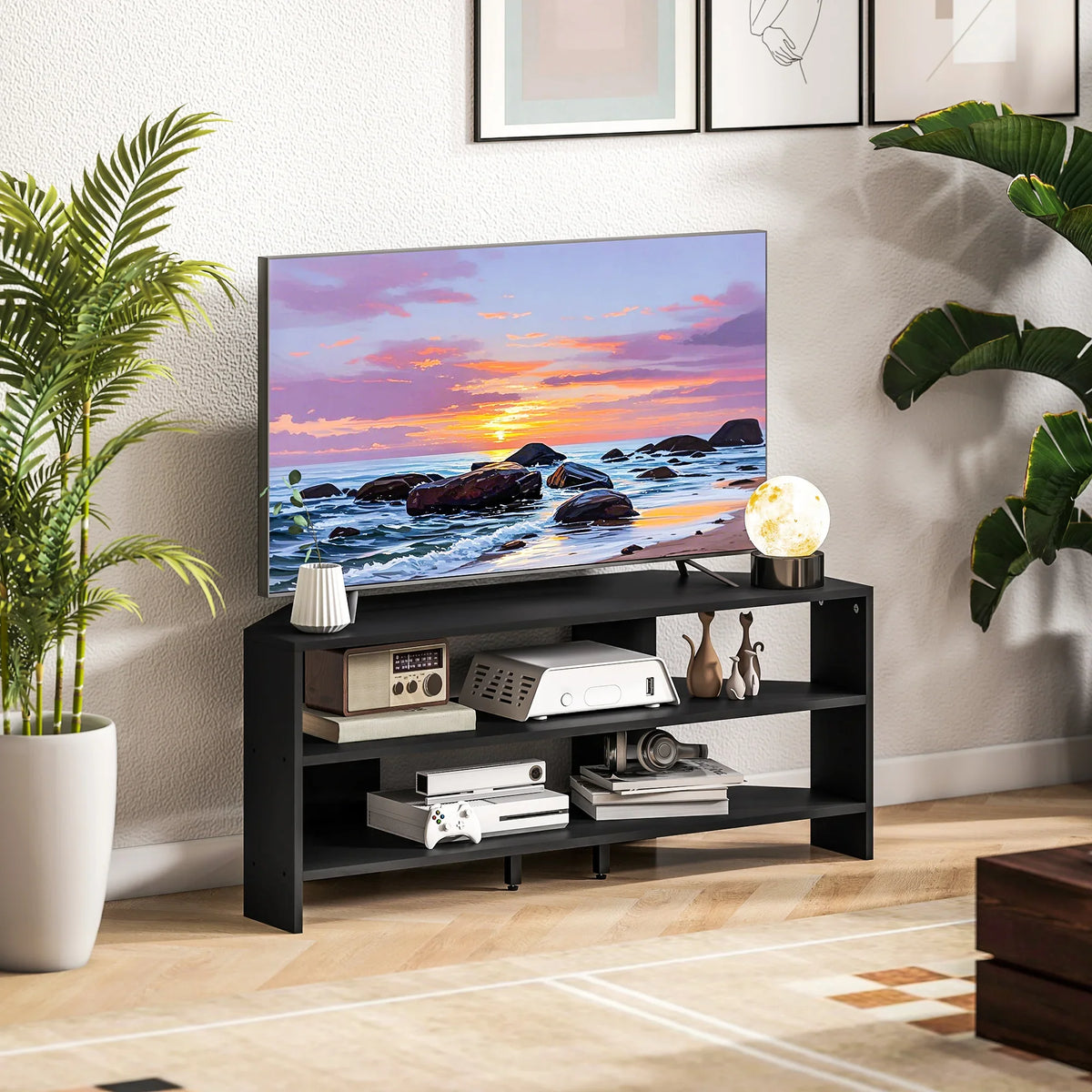 Black corner TV stand with open shelves supporting devices and media beneath TV