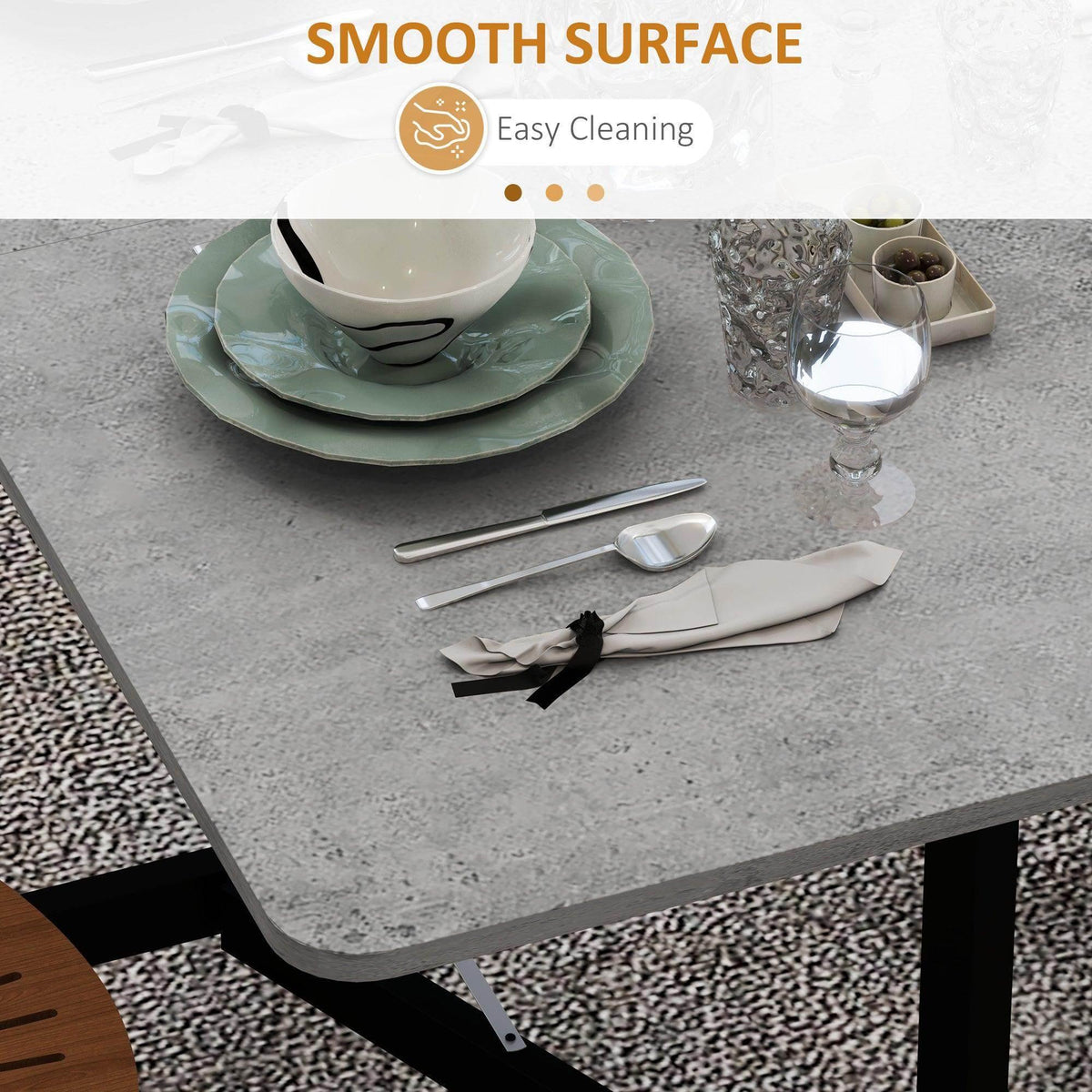 Grey smooth tabletop with rounded edges on black legs, easy to clean surface