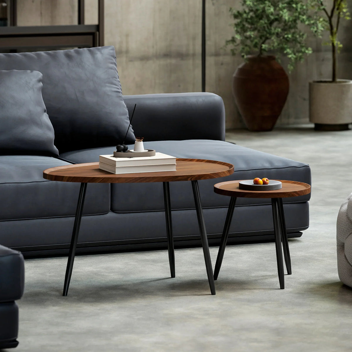 Set of 2 round nesting coffee tables with chestnut wood-effect tops and black metal legs