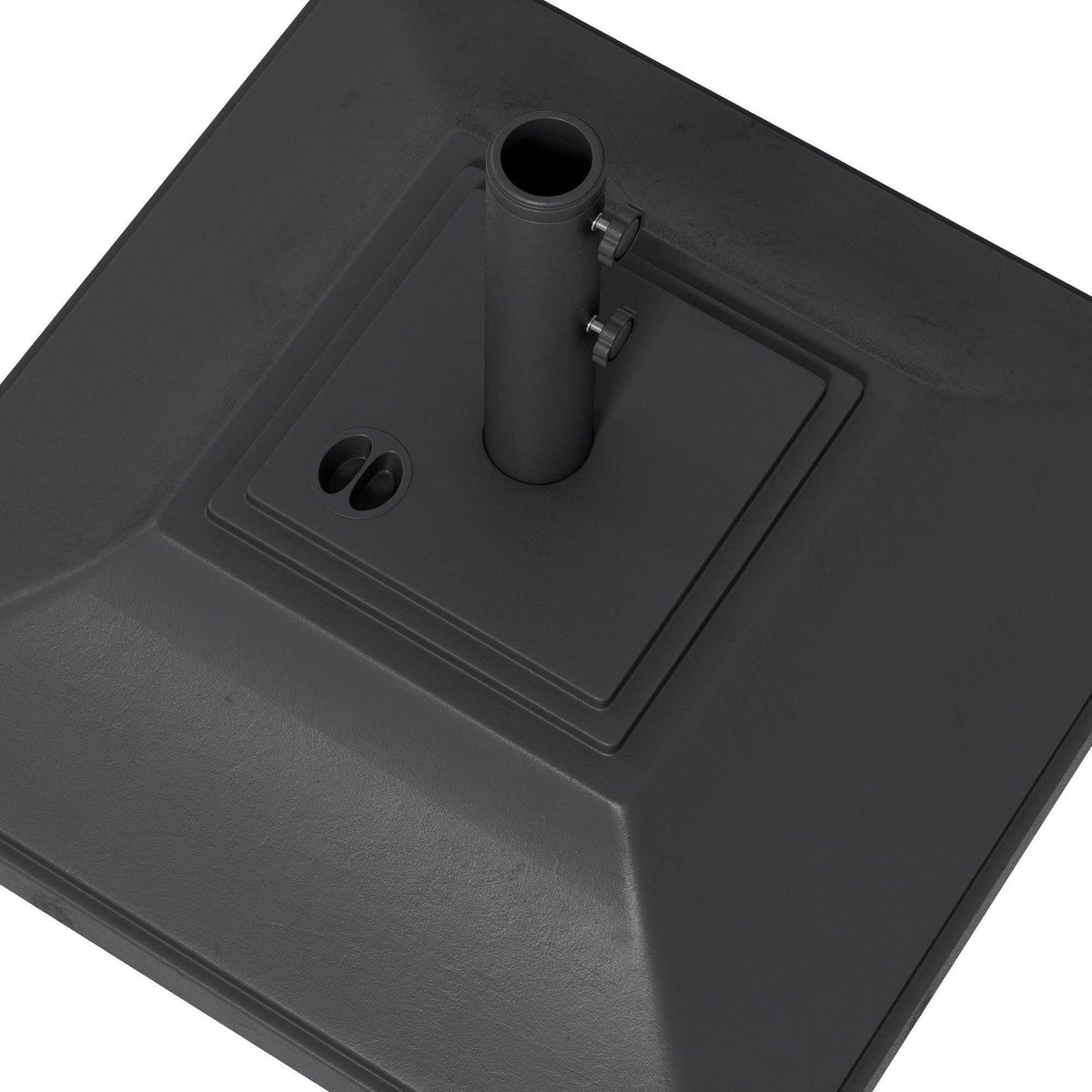 Close-up of black umbrella base top plate with center tube opening and small side holes.