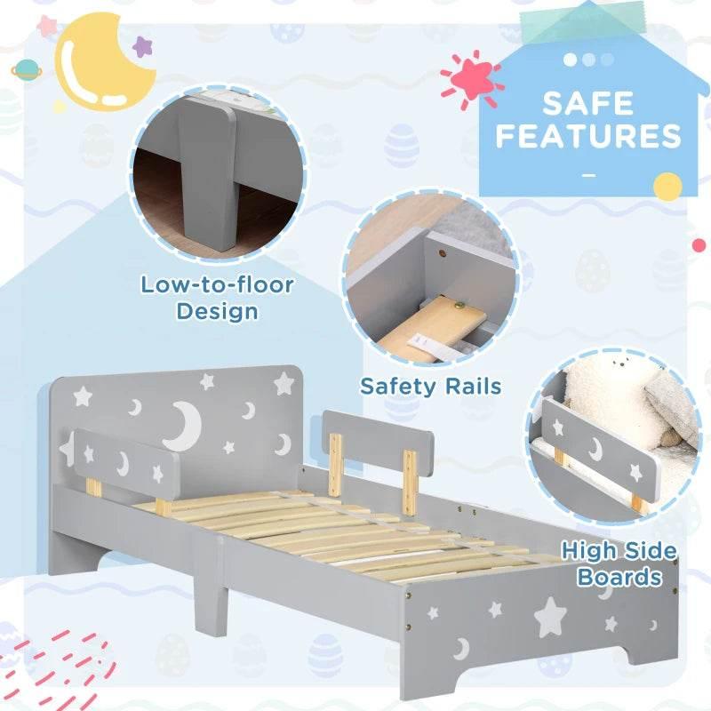 Grey kids low-floor bed with safety rails and star-and-moon side panels