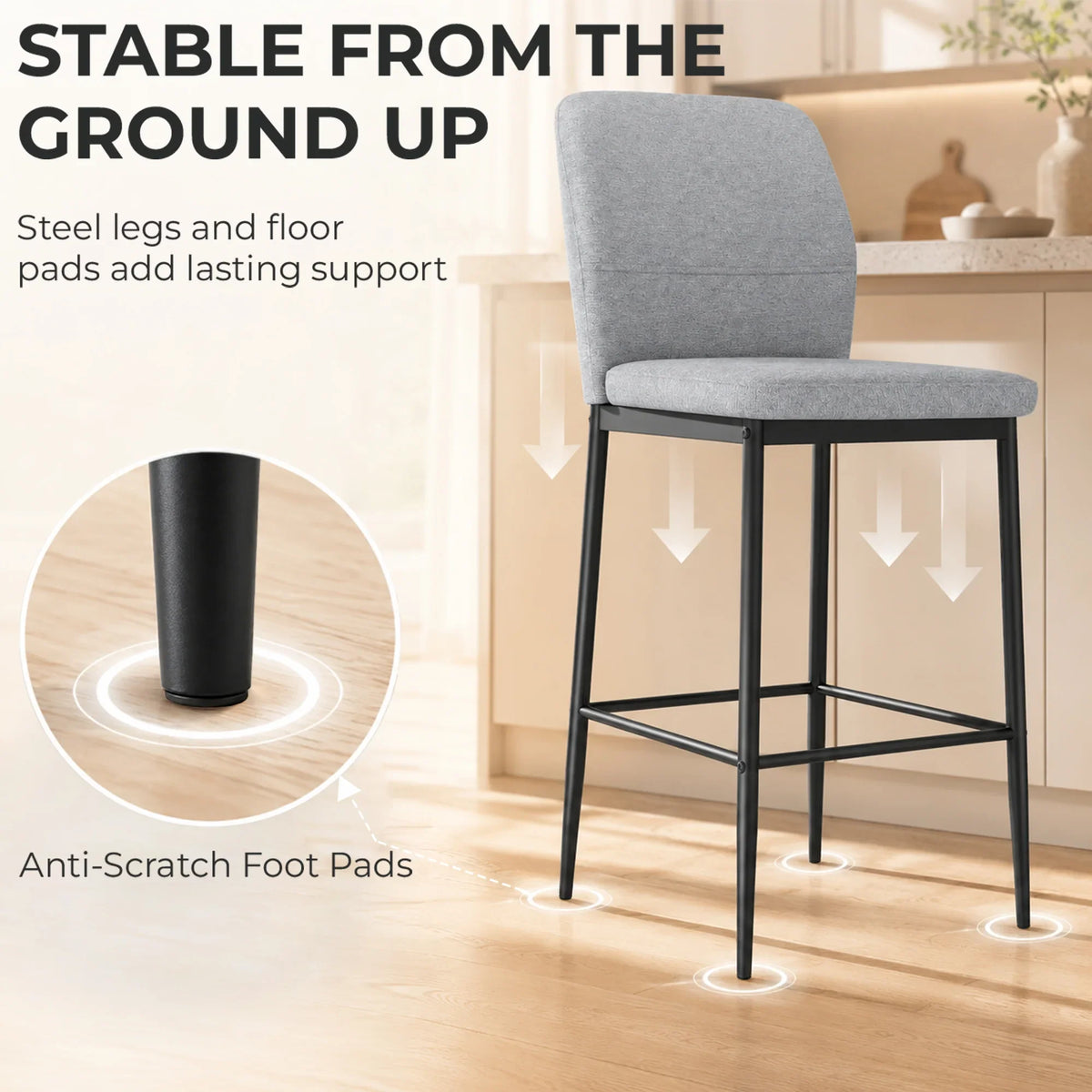 Grey bar stool showing anti-scratch foot pads on black legs, cushioned backrest