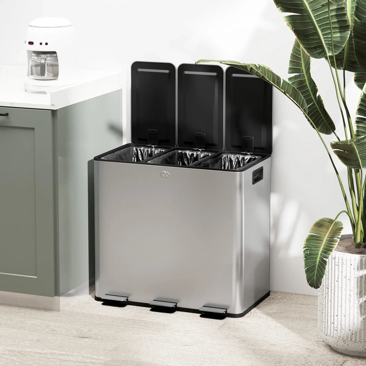 Stainless steel triple pedal recycling bin with three black inner buckets
